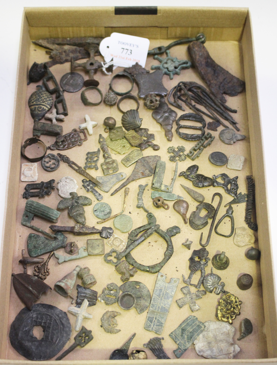 A collection of medieval and later artifacts, including a copper alloy quad matrix seal, width 4.