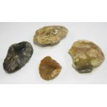 A group of four Palaeolithic stone axes, largest length 12.5cm.Buyer’s Premium 29.4% (including