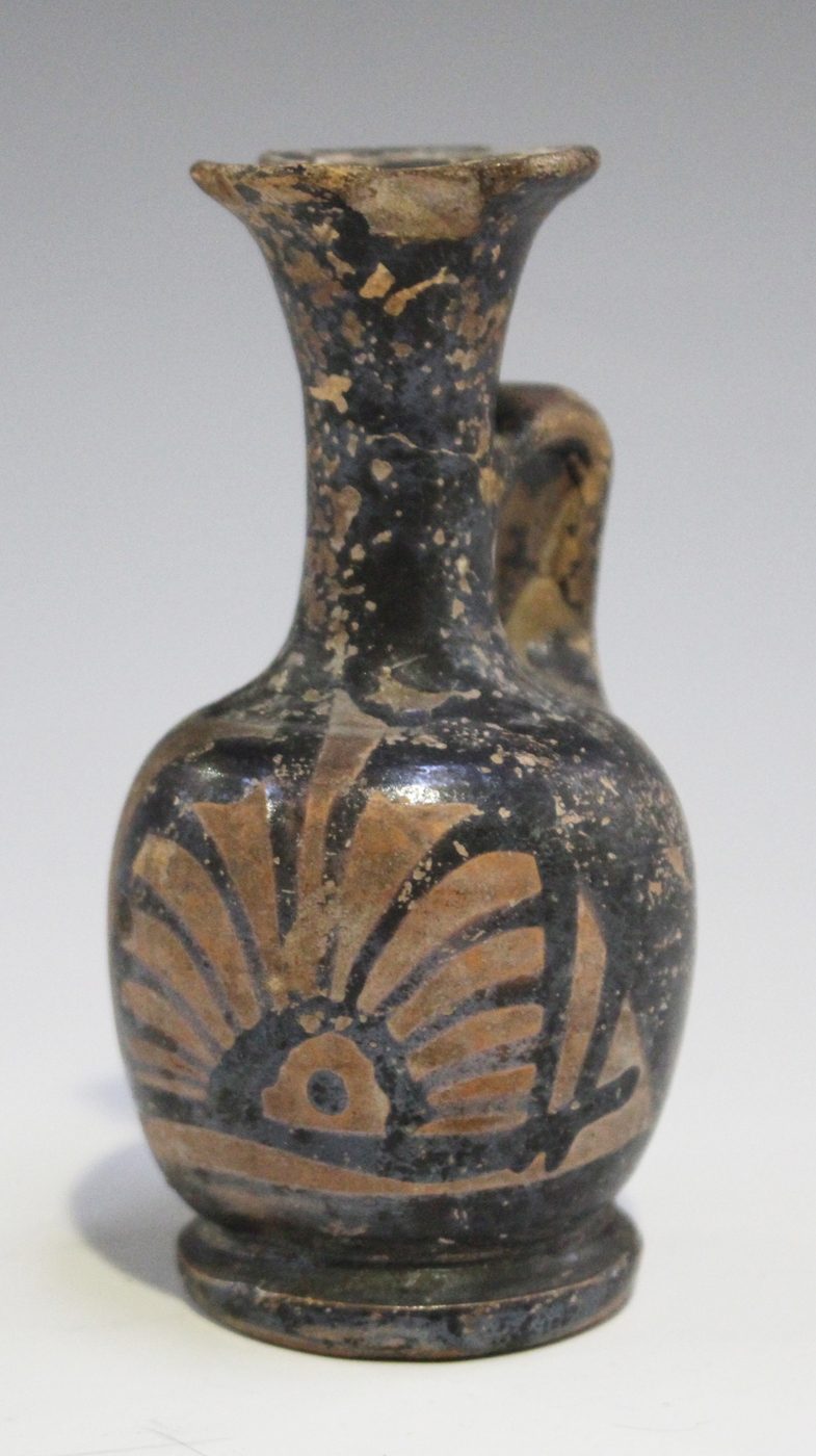 An Ancient Greek Apulian Xenon ware terracotta miniature ewer, circa 4th century BC, the black