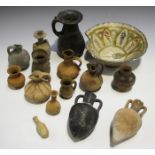 A collection of various ancient and later pottery items, including two small amphorae.Buyer’s