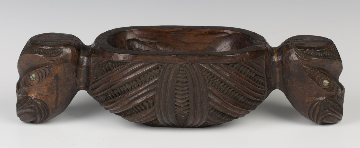 A Maori carved hardwood papa hou (treasure box), probably early 20th century, the ovoid body