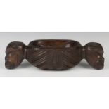 A Maori carved hardwood papa hou (treasure box), probably early 20th century, the ovoid body