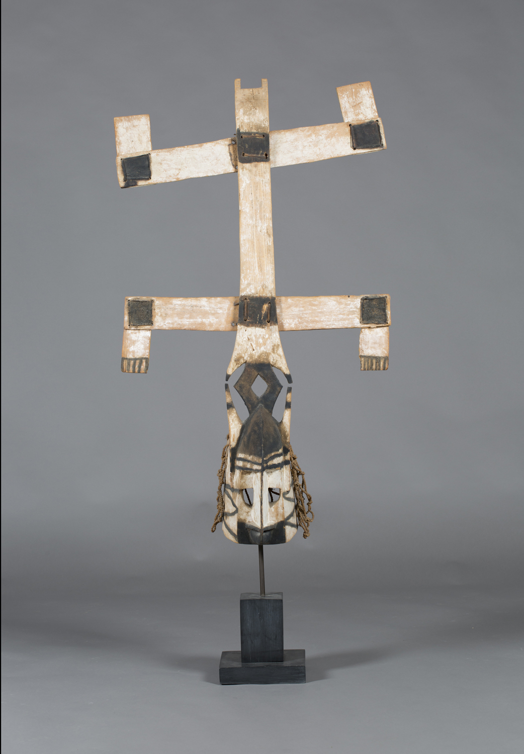 A Dogon Kanaga mask, Mali, the carved angular mask typically modelled with a double-barred cross