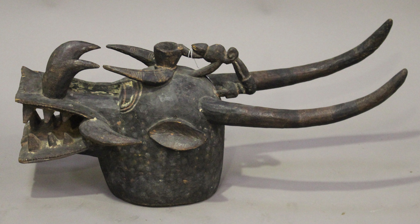 A Senufo Kponyungo carved and painted helmet mask, Ivory Coast, modelled typically in the form of - Image 3 of 4