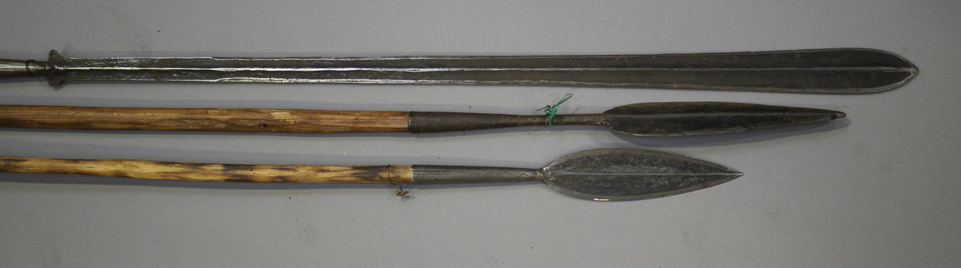 A Maasai lion spear and two other spears, Kenya, lengths 182cm, 180cm and 170cm.Buyer’s Premium 29.