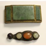 A Chinese gilt bronze and jade belt buckle, late Qing dynasty, the three rectangular jade plaques