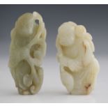 A Chinese pale celadon jade pendant, probably late Qing dynasty, carved in the form of a boy