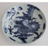 A Chinese blue and white export porcelain saucer dish, 18th century, painted inside and out with a