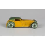 A Dinky Toys coupé car, finished in yellow and green with green wash wheels.Buyer’s Premium 29.4% (