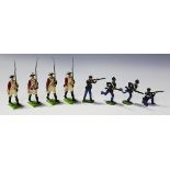 A collection of Britains and other lead soldiers, including Highlanders standing firing, Hussars,