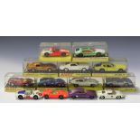 A small collection of Dinky Toys cars, comprising a No. 131 E-Type Jaguar 2+2, a No. 132 Ford 40-RV,