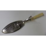 A pair of George III silver fish tongs with pierced spring action blades, each engraved with a