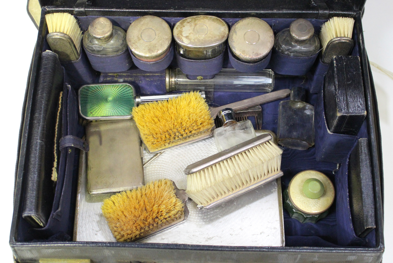 A George V leather travelling vanity case, the interior containing a selection of silver mounted - Image 4 of 4