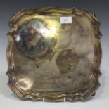 A silver square presentation salver with piecrust rim, inscribed 'Bowater Scott 1962' amongst a