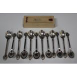 A set of twelve Danish .830 silver teaspoons, circa 1923-1929, each with stylized crocus moulded