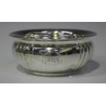 A George V silver circular bowl with outswept rim above a lobed body, Birmingham 1915 by Joseph