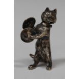 A Continental silver novelty vesta case in the form of a cat playing a pair of cymbals, with