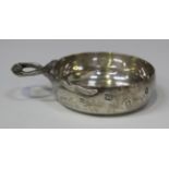 A silver tasse du vin of circular form with two entwined snakes handle, the side engraved 'Golf