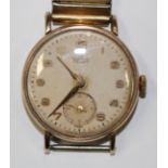 A Smiths De Luxe 9ct gold circular cased gentleman's wristwatch, with a gilt jewelled movement,