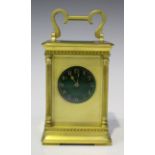 A late 19th century French brass cased carriage clock with eight day movement striking hours and