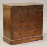 A Victorian stained pine chest of two short and three long drawers, on a plinth base, height