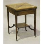 A late Victorian rosewood and boxwood inlaid envelope card table, raised on square tapering legs