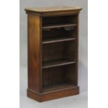 A Victorian mahogany bookcase, the moulded top above three adjustable shelves, on a plinth base,