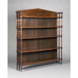 An early Victorian mahogany five-tier open bookcase with turned and block supports, on turned