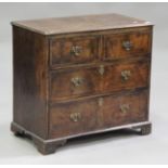 An 18th century and later walnut chest of two short and two long drawers, on bracket feet, height