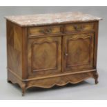 An early 20th century French walnut side cabinet, the marble top above two drawers and a pair of