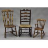 A 19th century provincial turned ash ladder back rocking chair, height 92cm, together with another