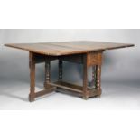 A 17th/18th century German oak gateleg dining table, probably Bergisch area, the rectangular drop-