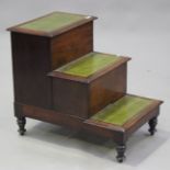 A set of 19th century mahogany library steps fitted with two hinged compartments, raised on turned