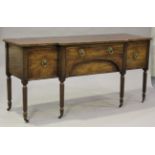 A Regency mahogany breakfront sideboard, the top with a chequer inlaid edge above four drawers