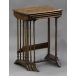 An early 20th century French walnut and marquetry inlaid quartetto nest of occasional tables, on