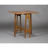 An Edwardian Arts and Crafts oak Sutherland occasional table, possibly retailed by Liberty & Co, the