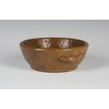 A Robert 'Mouseman' Thompson oak circular bowl, the heavily adzed side with typical carved mouse