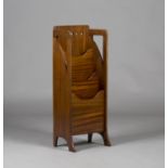 An Edwardian Arts and Crafts Glasgow School mahogany magazine rack, probably made by Wylie &