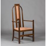 An Edwardian Arts and Crafts mahogany elbow chair, in the manner of Leonard Wyburd and possibly