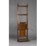 A late 19th century Aesthetic period walnut and brass mounted hallstand, attributed to James