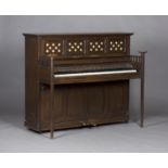 An early 20th century Arts and Crafts oak cased upright piano by J.B. Cramer & Co. London, the