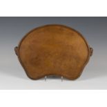 A Robert 'Mouseman' Thompson oak tea tray of shaped form, the raised border carved with opposing