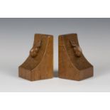 A pair of Robert 'Mouseman' Thompson oak bookends, each curved end with typical carved mouse