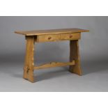 An early 20th century Arts and Crafts pale oak side table, fitted with two frieze drawers and raised