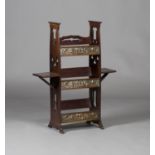 An Edwardian Arts and Crafts mahogany three-tier book trough, in the manner of Shapland & Petter,