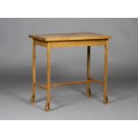 An Edwardian Arts and Crafts oak rectangular occasional table, raised on block legs with pierced