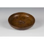 A Robert 'Mouseman' Thompson oak circular bowl, the centre with typical carved mouse signature,