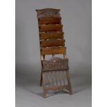 An early 20th century Irish Arts and Crafts walnut magazine rack by 'The Kilkenny Woodworkers',