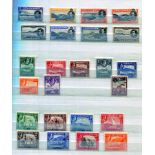 A collection of world stamps contained within nine stock books and an album, including Great