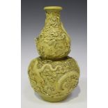 A Chinese yellow enamelled biscuit porcelain double gourd shaped vase, mark of Qianlong but probably